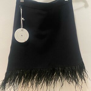 Never worn STAUD black mini skirt with feather trim (NWT)